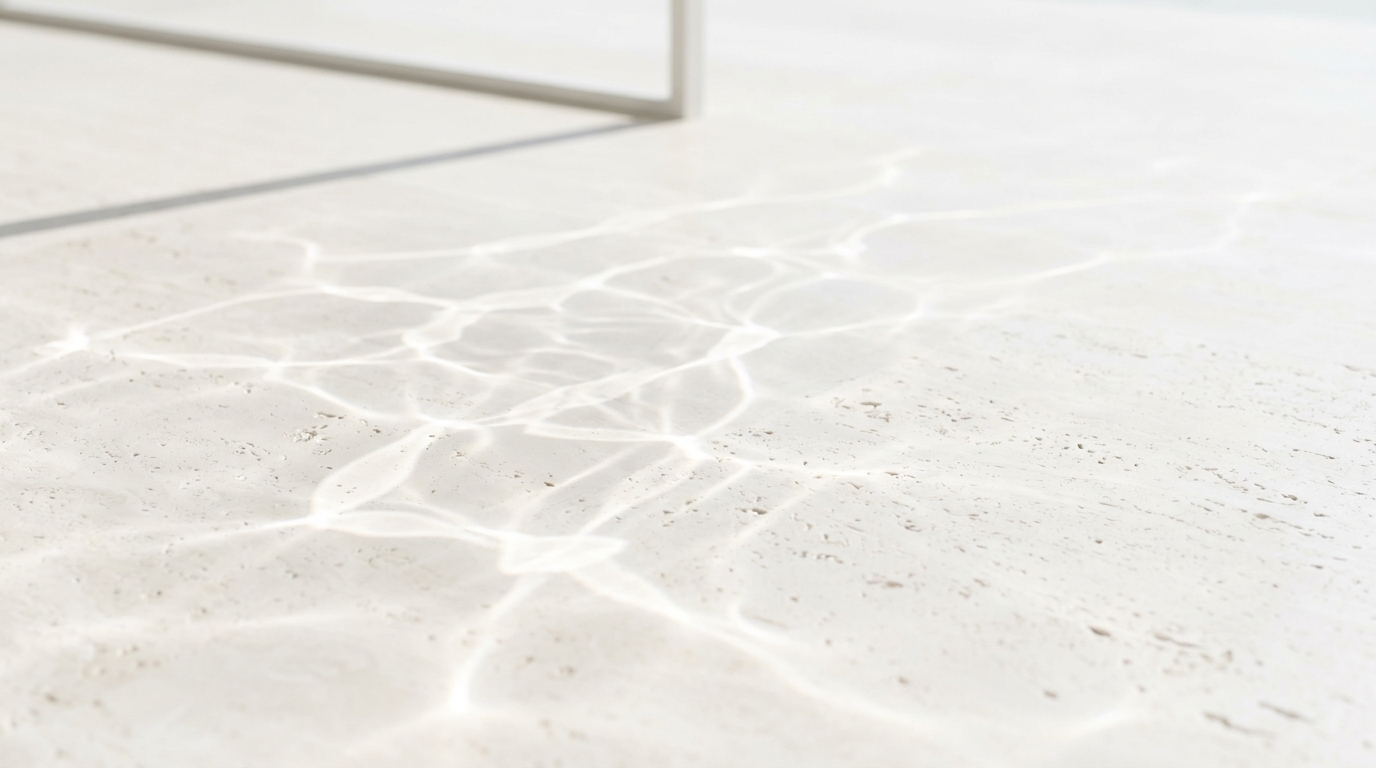 Crystalline water light caustics on pale stone